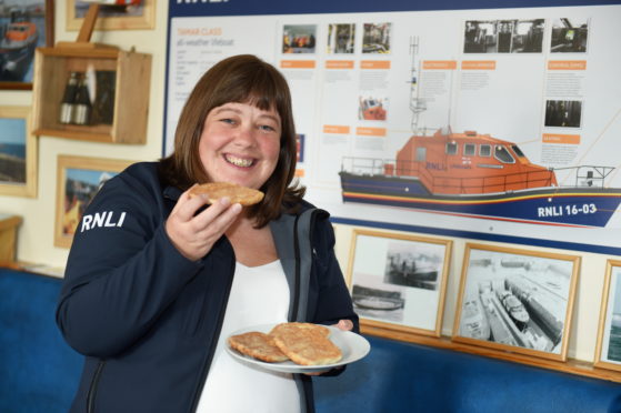 RNLI Peterhead's fundraising chairwoman Caroline Weir with a buttery.
Picture by Paul Glendell