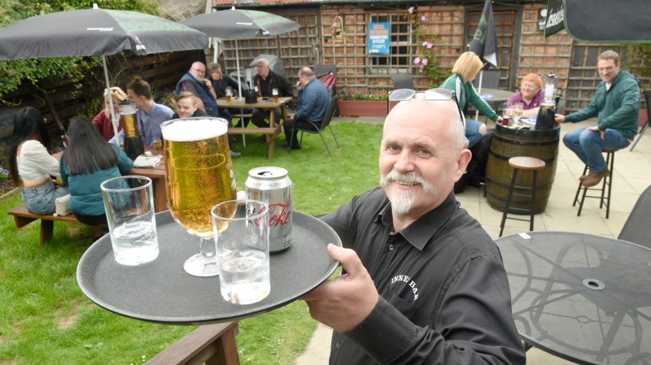 The Innes Bar owner Craig MacLeod toasts being able to reopen.