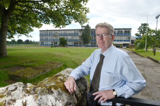 Highland councillor Alasdair Rhind outside Tain Royal Academy which suffered deliberate damage to its roof in June.
Picture by Sandy McCook