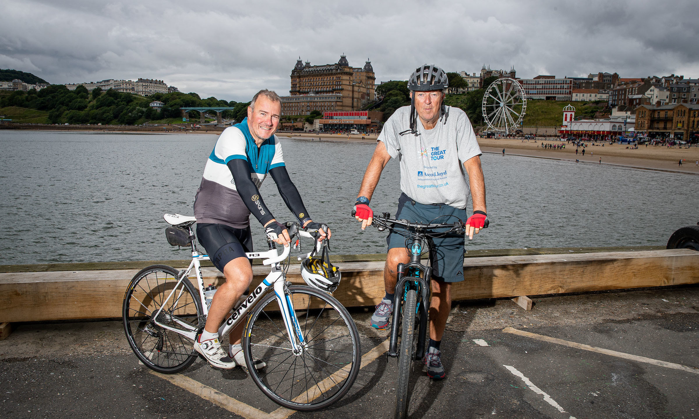 Hugh Roberts (SweetSpot Managing Director) and Robin Young pictured after the Scarborough leg of their cycle around the coastline of Britain.