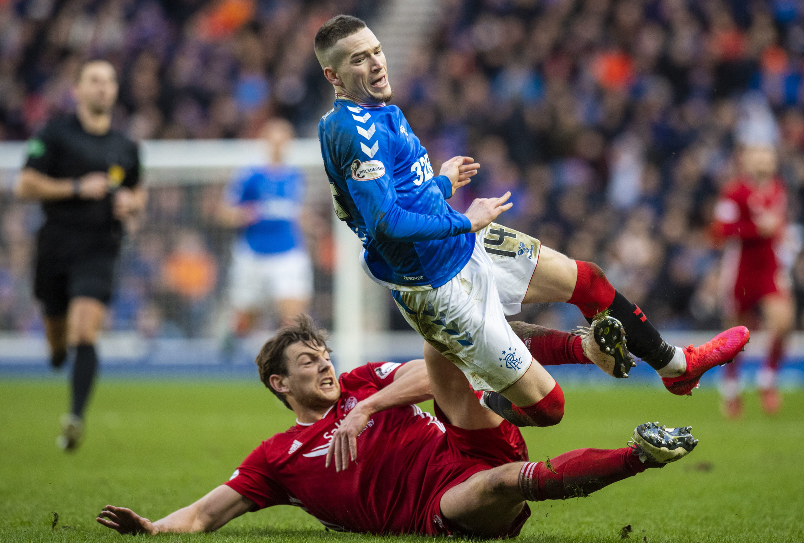 Ash Taylor tackles Ryan Kent during an Aberdeen v Rangers clash last season