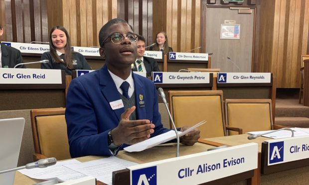 Shayne Omale in the Aberdeenshire Council chambers.