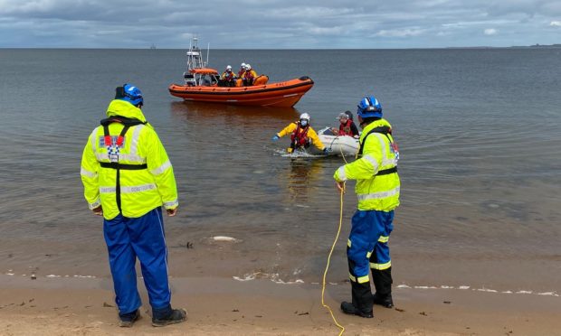 Kessock lifeboat launched to provide assistance off Rosemarkie Beach as the dinghy experienced engine failure