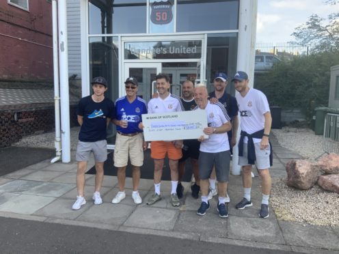 From left,  Dundee United midfielder and former Cove Rangers loanee Declan Glass, Cove secretary Duncan Little, former Cove player and coach Roy McBain, Cove youth coach Gary Hake, Cove goalkeeping coach John McCafferty and Dundee United captain Mark Reynolds.