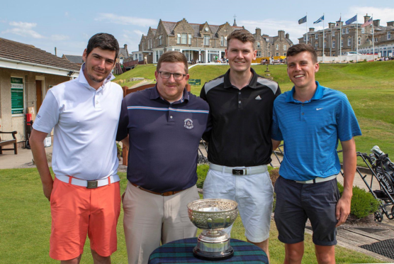 Aaron Stewart (right) and Scott Lorimer (far right) complete golfing challenge.