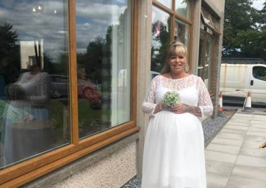Amanda Leil surprised residents at Keith care house by arriving in her wedding dress.