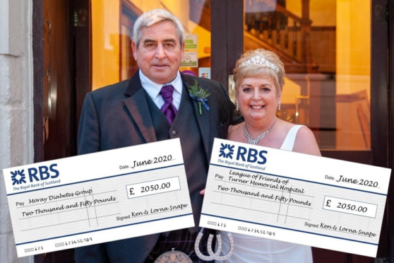 Ken Snape and Lorna Snape on their wedding day with the charity cheques.