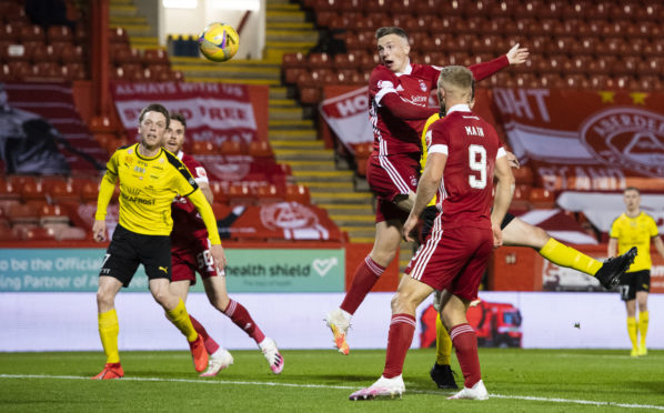 Lewis Ferguson heads against Runavik in the first qualifying round.