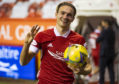 Aberdeen's Ryan Hedges with the match ball after scoring a hat-trick against NSI Runavik