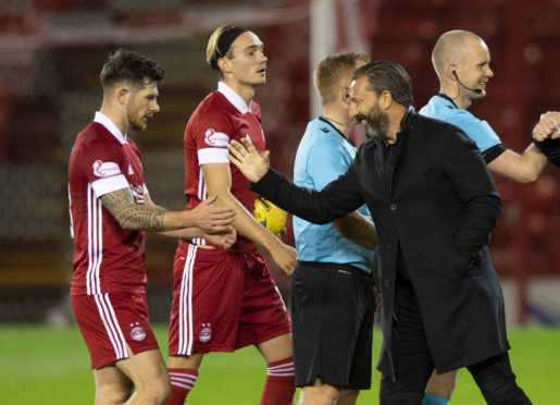 Dons boss DerekMcInnes (right) with Matty Kennedy at full-time against Runavik.