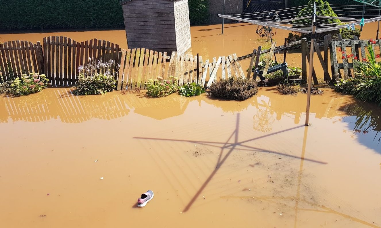 A shoe floats through the back garden of a property on Salmon Lane. At one point it was under three feet of water.