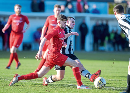 Tom Kelly playing for Brora Rangers