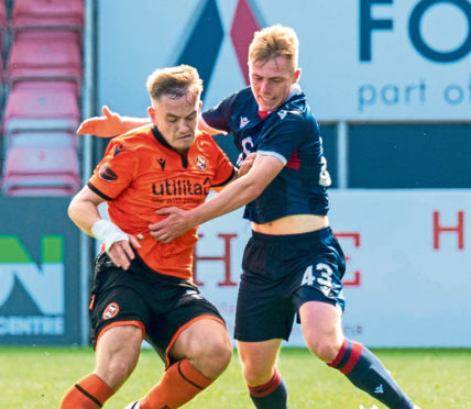 Josh Reid, right, in action for Ross County against Dundee United.