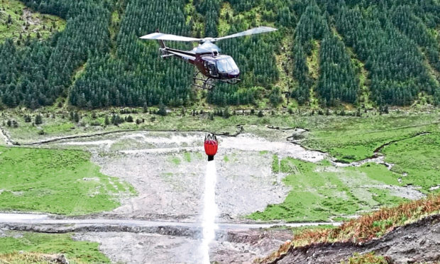 Helicopters were  used to dislodge heavy boulders threatening to fall on A83 in Argyll and Old Military Road below.