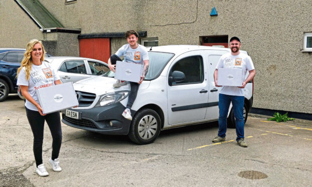 Cameron Esson, centre, and his team at Boozy Events deliver a drinks experience to a local charity