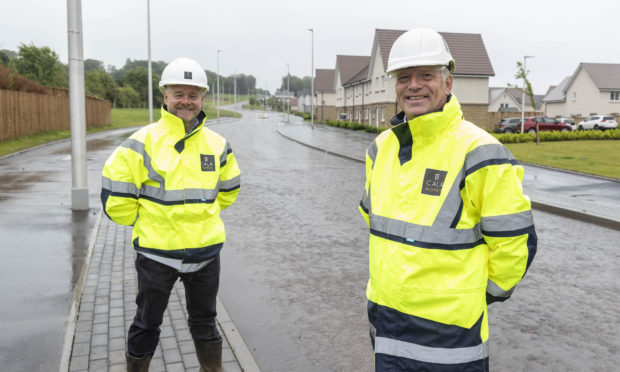 Cala Homes (North) construction director Stephen Jarvie and managing director Mike Naysmith on the newly-opened Craigbank Drive.