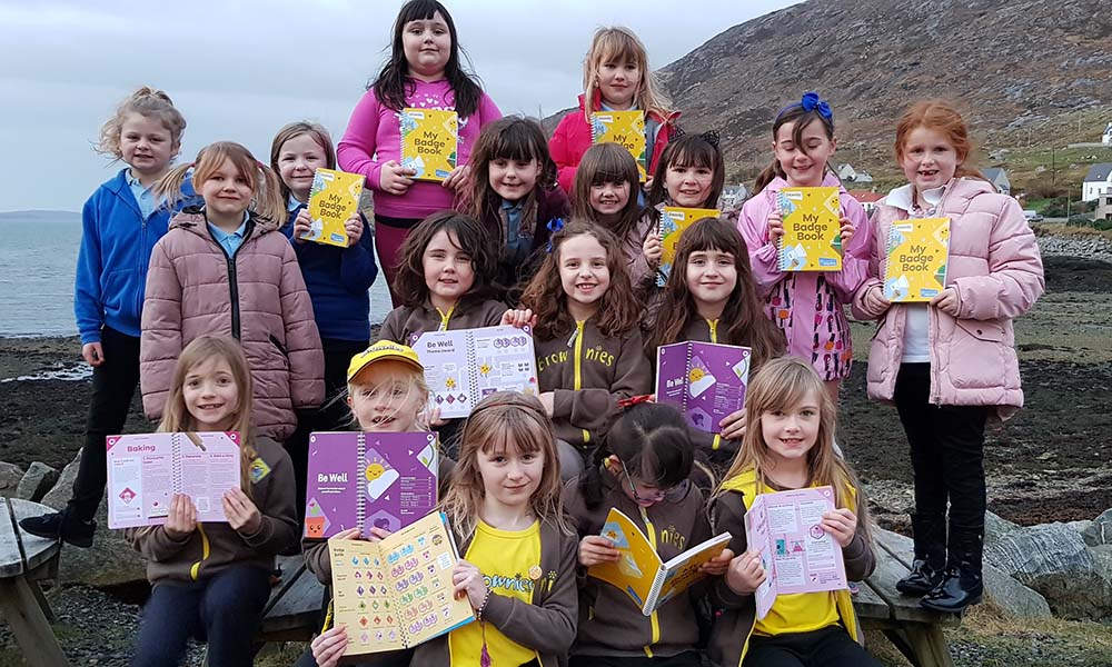 Isle of Harris Brownies with their new badge books, funded by The Scottish Salmon Company