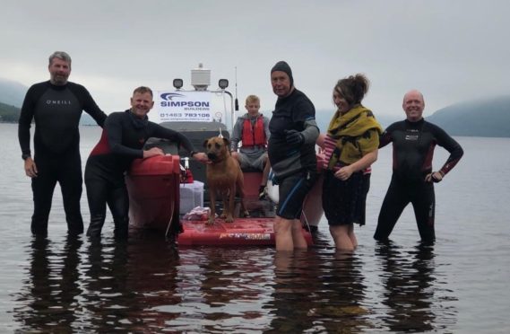 From left to right; Andrew Phillips, Gordon Simpson, Suli the dog, Alastair MacGregor, Aileen-Anne and Mark McCann