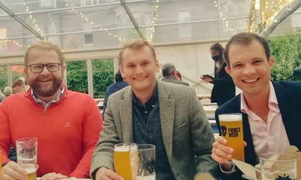 Andrew Bowie in an Aberdeen pub, posing for a photo within a metre of his friend.