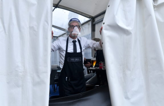 Kevin McKenzie, staff at The Grill, Union Street, as Aberdeen bars and restaurants were forced to close once again. 
Picture by Chris Sumner