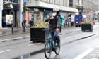 A Deliveroo delivery person cycling on Union Street, Aberdeen during the coronavirus outbreak.
Picture by Darrell Benns.