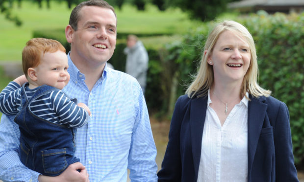 Douglas Ross with wife Krystle and son Alistair.