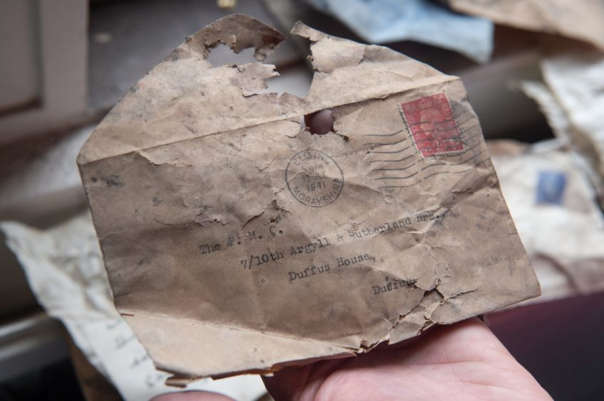 Secret messages, chocolate bar wrappers and cigarette packets were found under the floorboards.Pictures by Jason Hedges.