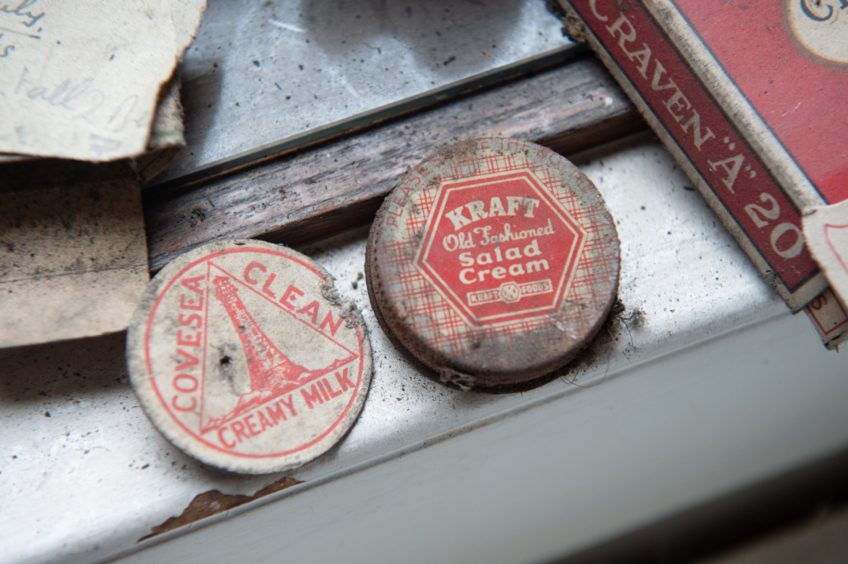 Secret messages, chocolate bar wrappers and cigarette packets were found under the floorboards.Pictures by Jason Hedges.