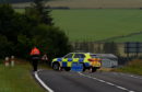 Police at the scene of the incident on the A96 south of Keith.