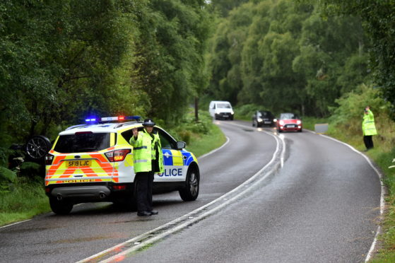 A woman has been taken to hospital following a one-vehicle crash