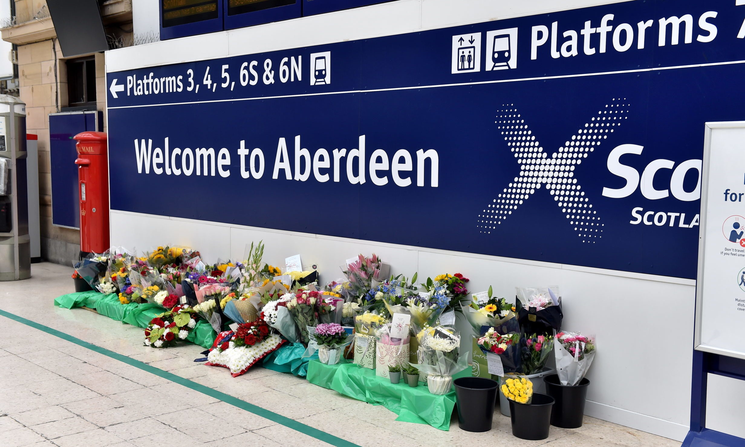 Flowers have been left at Aberdeen train station in memory of the victims. Picture by Scott Baxter