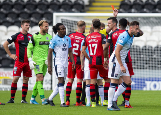 St Mirren's Joe Shaugnessy  (R) is shown red after a challenge on Ross County's Ross Stewart during the Scottish Premiership match between St Mirren and Ross County at St Mirren Park.