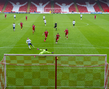 Ryan Kent slots Rangers' winner past Aberdeen keeper Joe Lewis on the opening day of the Premiership campaign.