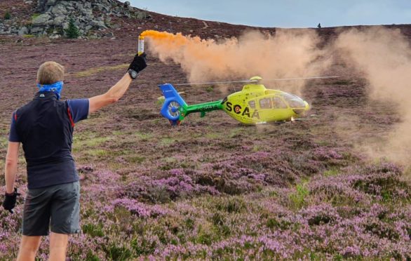 SCAA's Helimed 79 on the scene of a recent incident on Bennachie.