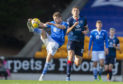 St Johnstone's David Wotherspoon (L) and Ross County's Ross Stewart during the Scottish Premiership match between St Johnstone and Ross County at McDiarmid Park.