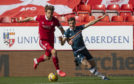 Aberdeen's Ash Taylor and Motherwell's Christopher Long in action