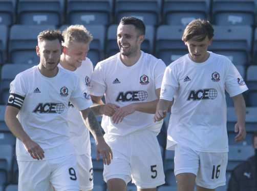 Cove Rangers players celebrate Scott Ross' opening goal against Dundee.