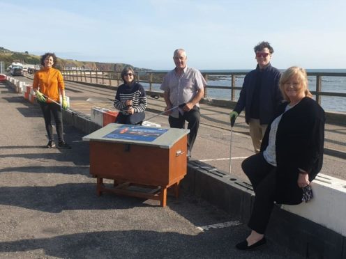 L-R: Mairi Gougeon MSP, Aberdeenshire Councillors Sarah Dickinson and Brian Topping, Turning the Plastic Tide project manager Crawford Paris, and Janice Langdon, owner of Molly's Cafe Bar in Stonehaven.