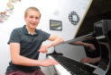 Pianist Aaron Magill, 16, who recently performed alongside the Scottish Orchestra (via zoom) after he composed some music for a song about mental health and coronavirus. 
Picture by Darrell Benns
