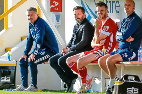 Derek McInnes looking shellshocked on the Dons bench.