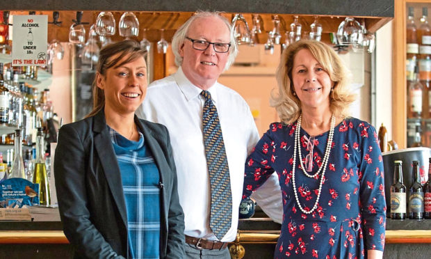 L-R: Jennifer Lamont, Murray Lamont and Ellie Lamont, owners of Mackays Hotel, in Wick.