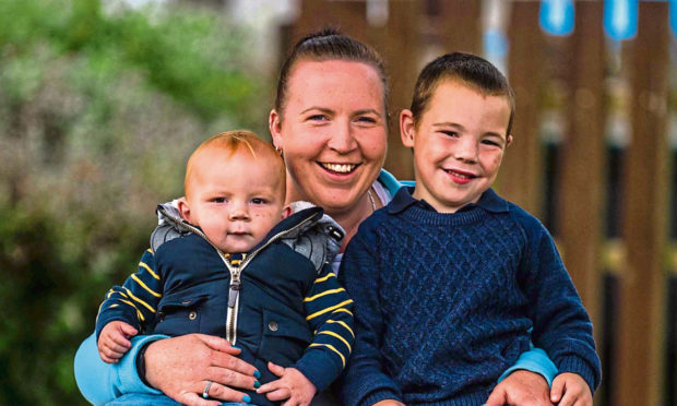 Dylan Morrison with proud mum Jenna Gordon and brother James Morrison, 15 months