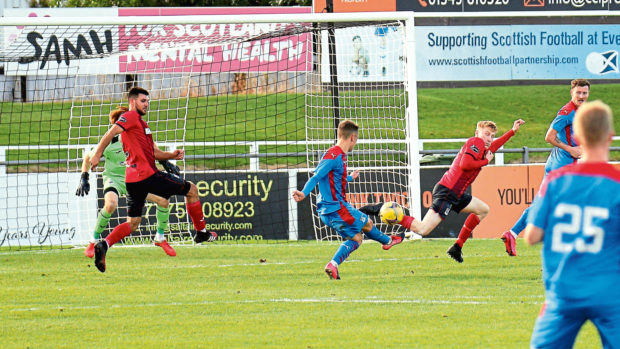 Roddy MacGregor strikes for Inverness and scores his second goal of the friendly against Elgin.