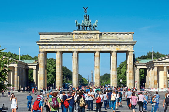 German Unity Day on Saturday will celebrate the Brandenburg Gate’s changing role, from nationalist symbol to tourist snap.