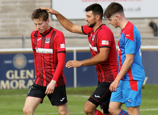 Kane Hester, left, after one of his goals against Inverness Caley Thistle.