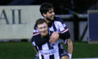 Shane Sutherland is congratulated by Rabin Omar.