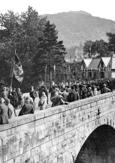 The march of the clans to the Braemar Gathering in 1928.