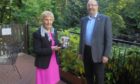 The Walter Smith Rosebowl was presented to Mrs Margaret Smith by the immediate past president of the club, Bob Watt. 
Picture: Banchory Rotary Club