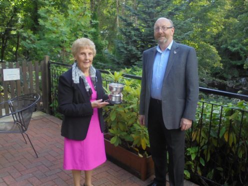 The Walter Smith Rosebowl was presented to Mrs Margaret Smith by the immediate past president of the club, Bob Watt. 
Picture: Banchory Rotary Club