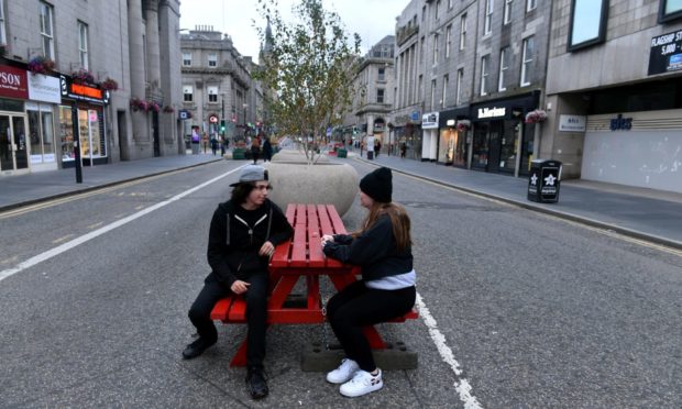 Members of the public try out the benches in Union Street. Picture by Chris Sumner.